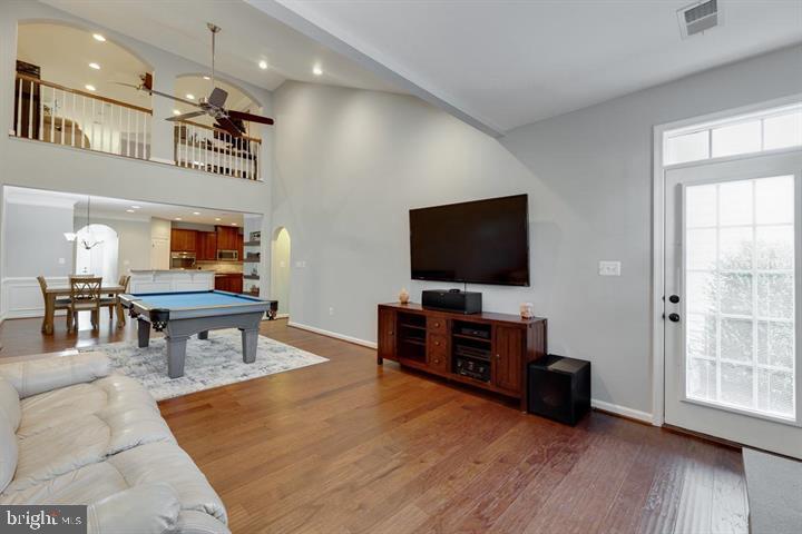 24876 Helms Terrace Aldie, VA 20105 - Photo 19 of 45 a living room with furniture and a flat screen tv