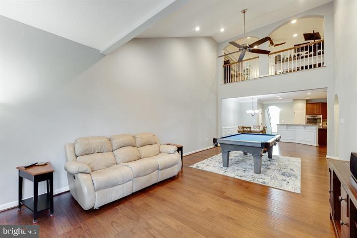 24876 Helms Terrace Aldie, VA 20105 - Photo 20 of 45 a living room with furniture and a wooden floor