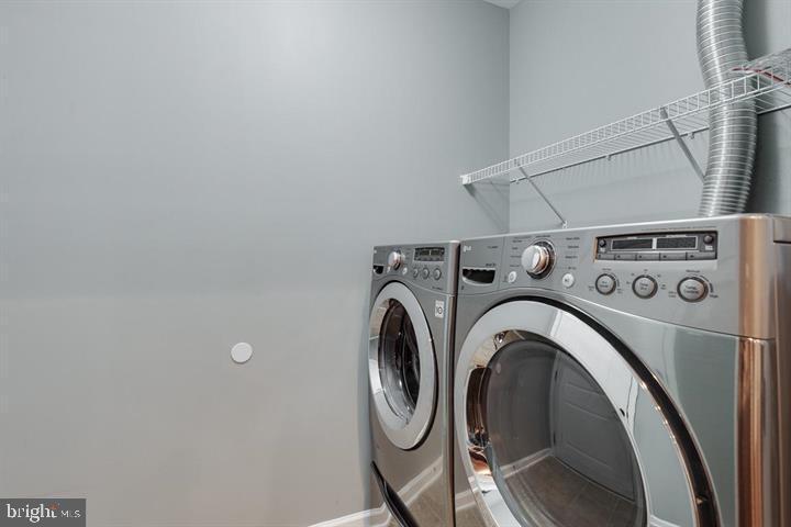 24876 Helms Terrace Aldie, VA 20105 - Photo 23 of 45 a utility room with dryer and washer