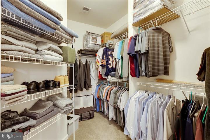 24876 Helms Terrace Aldie, VA 20105 - Photo 27 of 45 a view of walk in closet with clothes and shoes