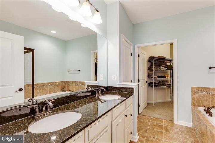 24876 Helms Terrace Aldie, VA 20105 - Photo 28 of 45 a bathroom with a sink double vanity and a mirror