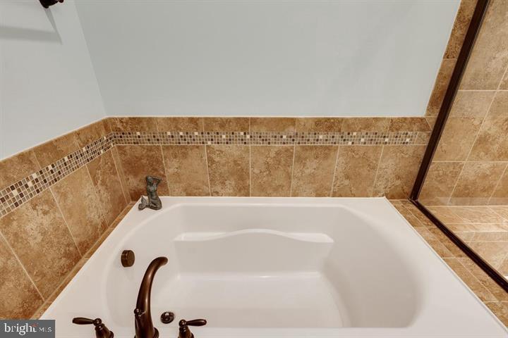 24876 Helms Terrace Aldie, VA 20105 - Photo 30 of 45 a bathroom with a bathtub