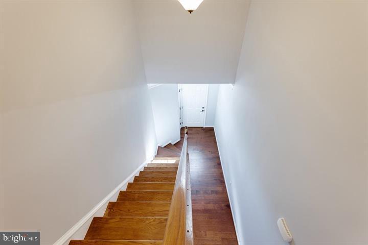 24876 Helms Terrace Aldie, VA 20105 - Photo 31 of 45 a view of a hallway with wooden floor