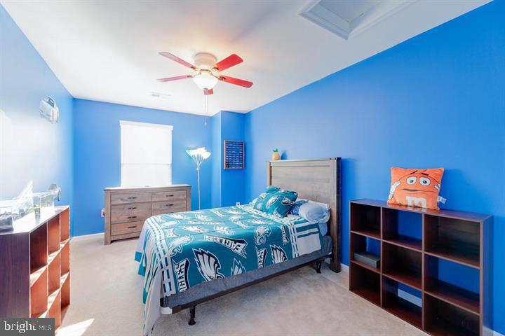 24876 Helms Terrace Aldie, VA 20105 - Photo 36 of 45 a bedroom with a bed and a chandelier