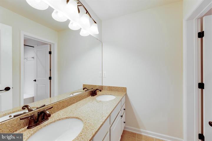 24876 Helms Terrace Aldie, VA 20105 - Photo 39 of 45 a bathroom with a sink and mirror