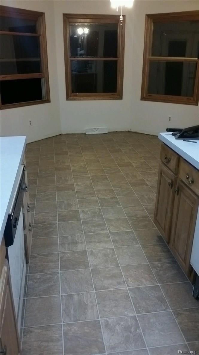 8492 South County Line Road Gaines, MI 48436 - Photo 12 of 16 New floors in kitchen.