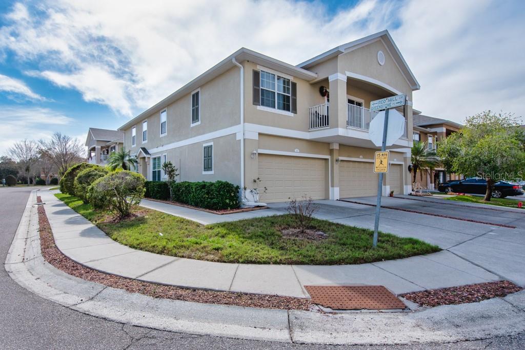 7525 Red Mill Circle New Port Richey, FL 34653 - Photo 33 of 41 a front view of a house with garden