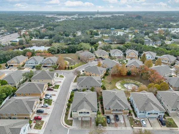 an aerial view of a house with swimming pool