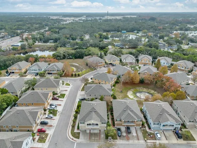 an aerial view of a house with swimming pool