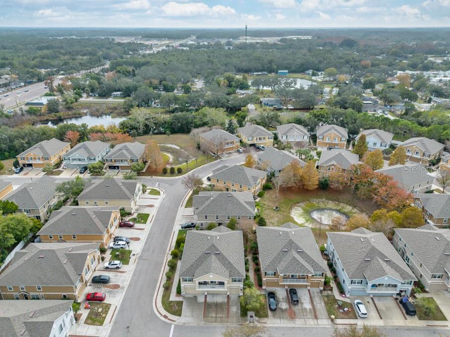 7525 Red Mill Circle New Port Richey, FL 34653 - Photo 40 of 41 an aerial view of residential houses with outdoor space
