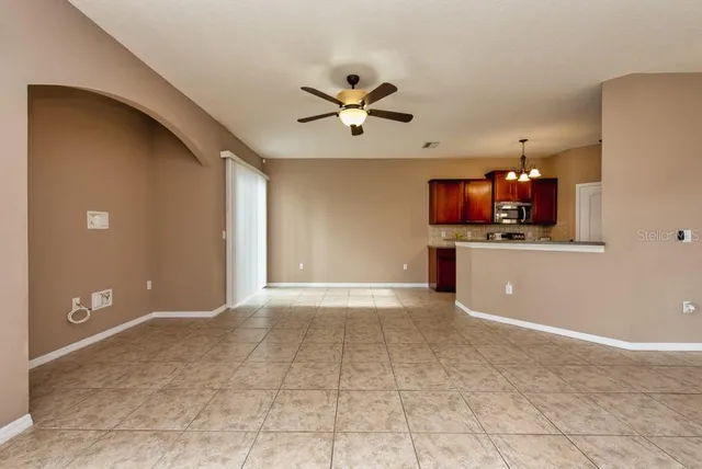 a view of a kitchen with a sink and a microwave
