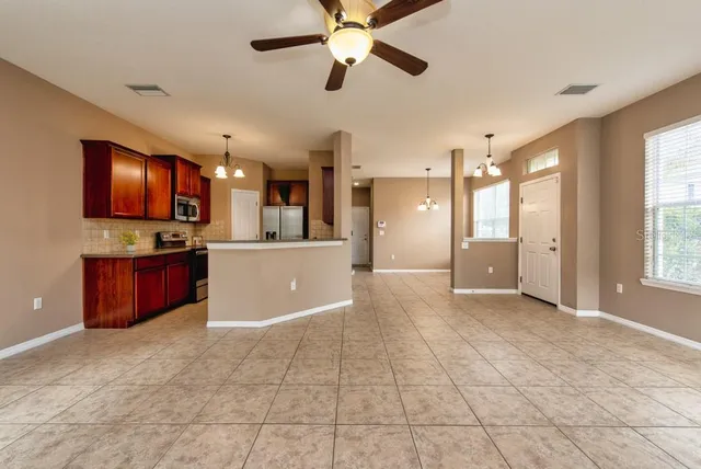 a view of a kitchen with a sink and a window