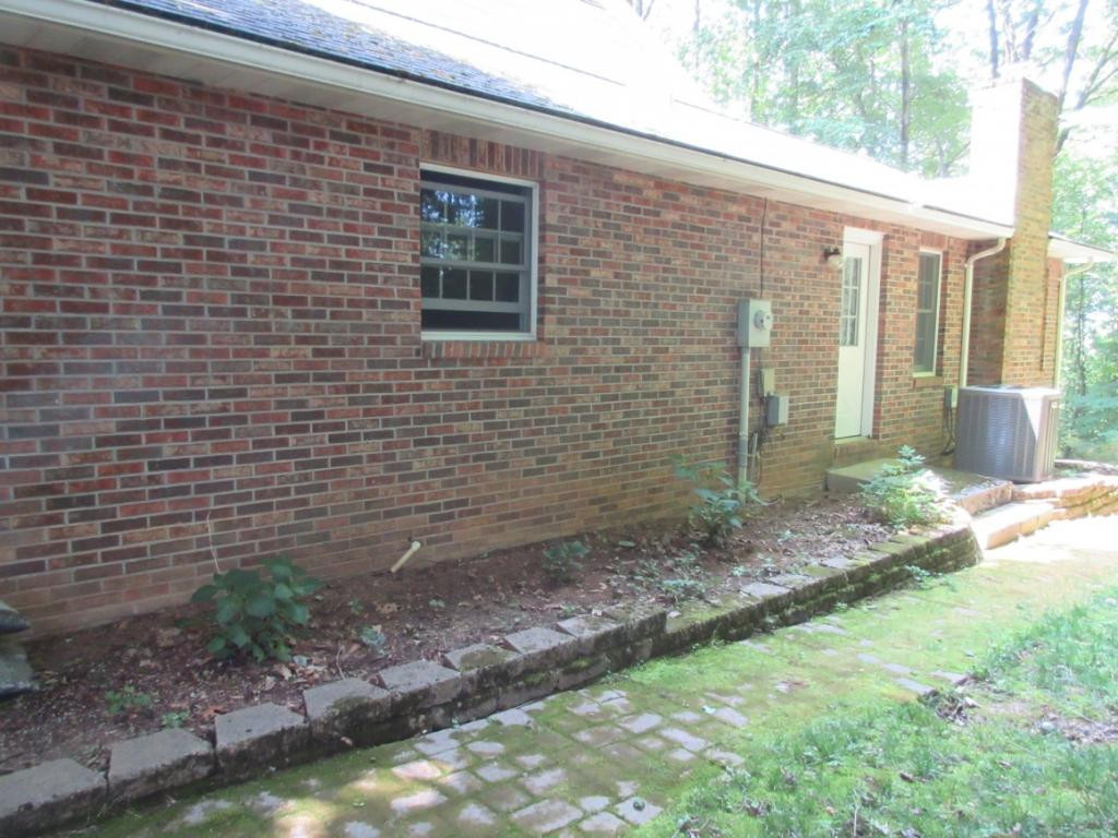 1608 Colonial Ridge Road Johnson City, TN 37604 - Photo 32 of 36 Side Paver Beds Walkway