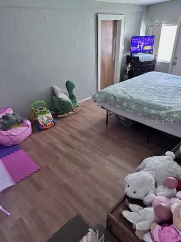 a bedroom with a bed and closet