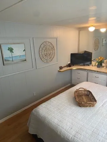 a room with a bed and cabinets