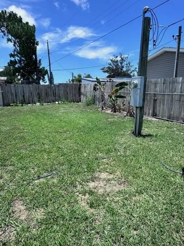 a view of a yard with an outdoor space