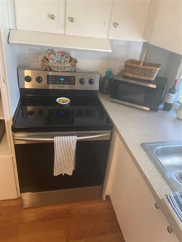 a bed room with a bed and a television