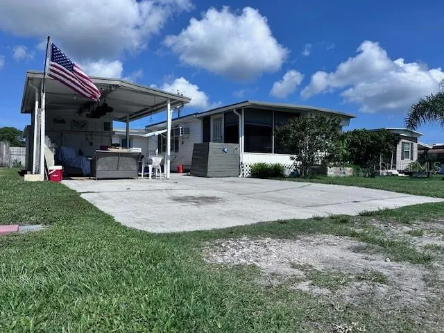 a view of a house with a yard garden and patio
