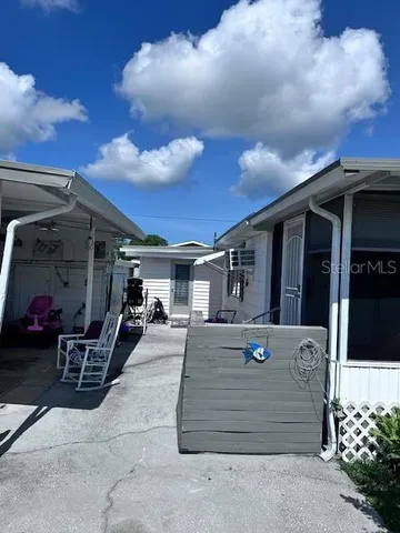 a view of a car park in front of house