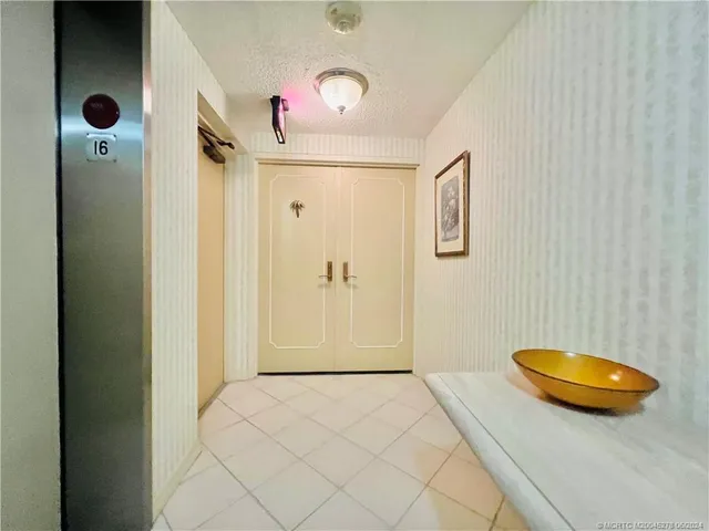 a view of a livingroom with furniture and chandelier