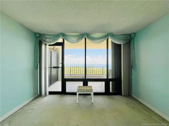 a view of a lake with a yard