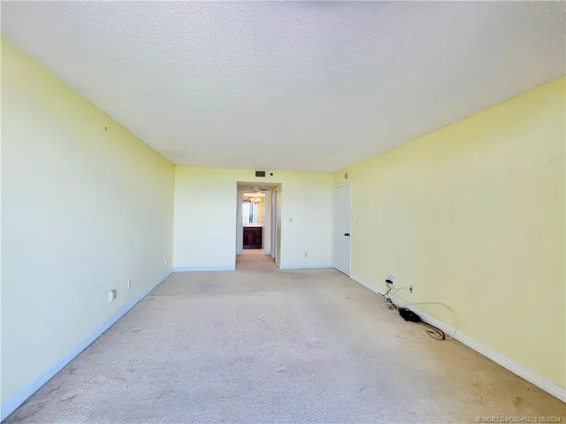 a kitchen with stainless steel appliances granite countertop a refrigerator stove microwave and cabinets