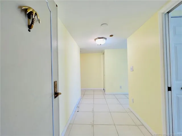 a kitchen with stainless steel appliances granite countertop a stove a sink and white cabinets