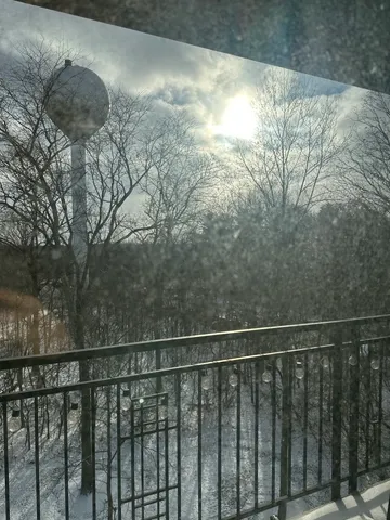 a view of balcony with wooden floor