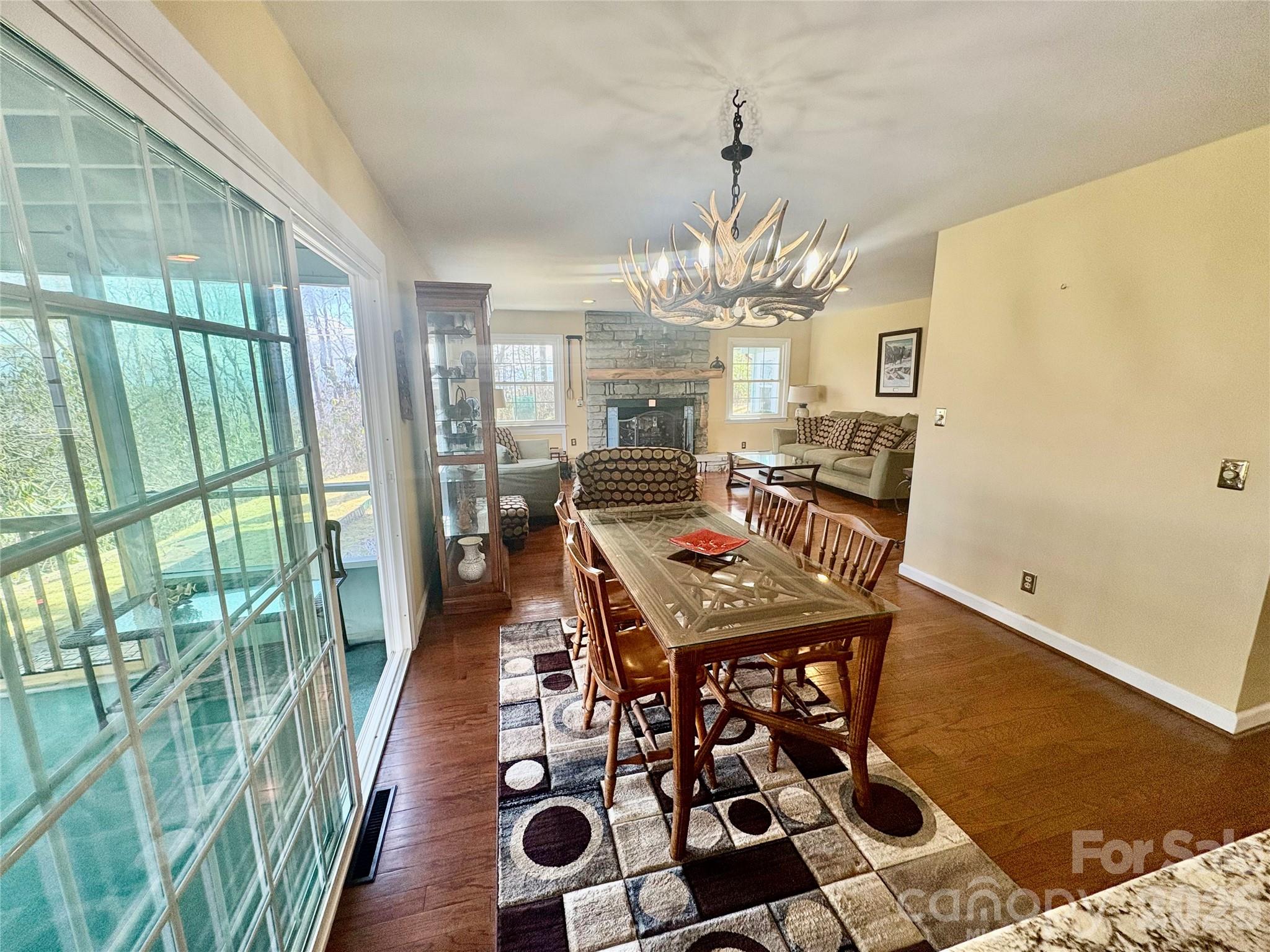 126 Ridgeview Road Spruce Pine, NC 28777 - Photo 11 of 39 a view of a dining room with furniture wooden floor and chandelier