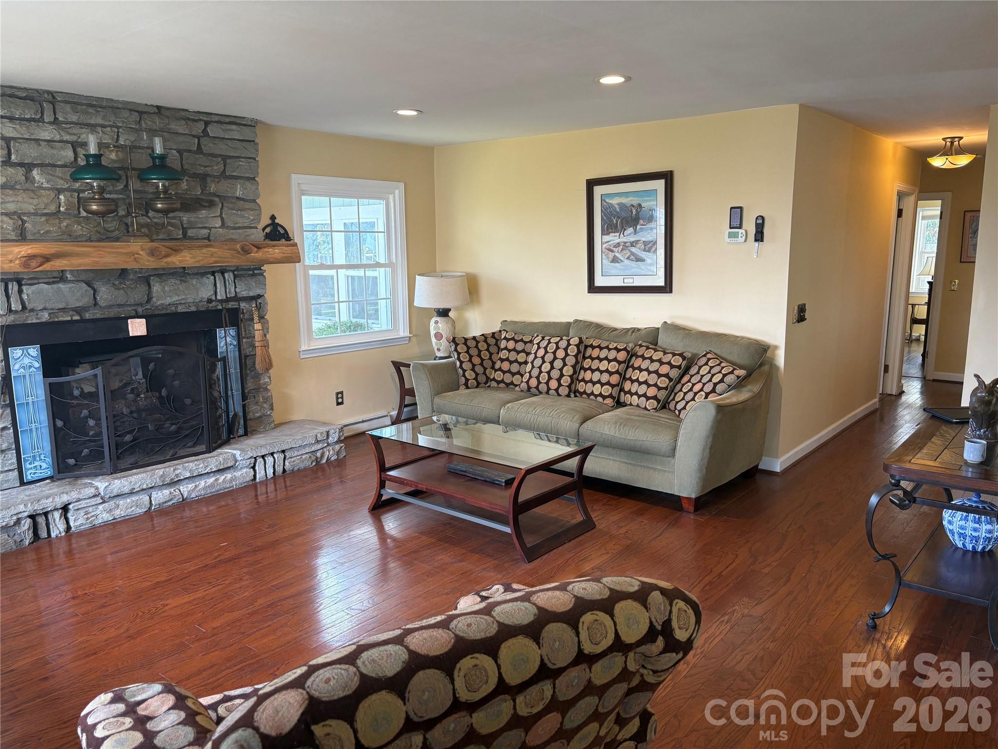 126 Ridgeview Road Spruce Pine, NC 28777 - Photo 14 of 39 a living room with furniture and a fireplace