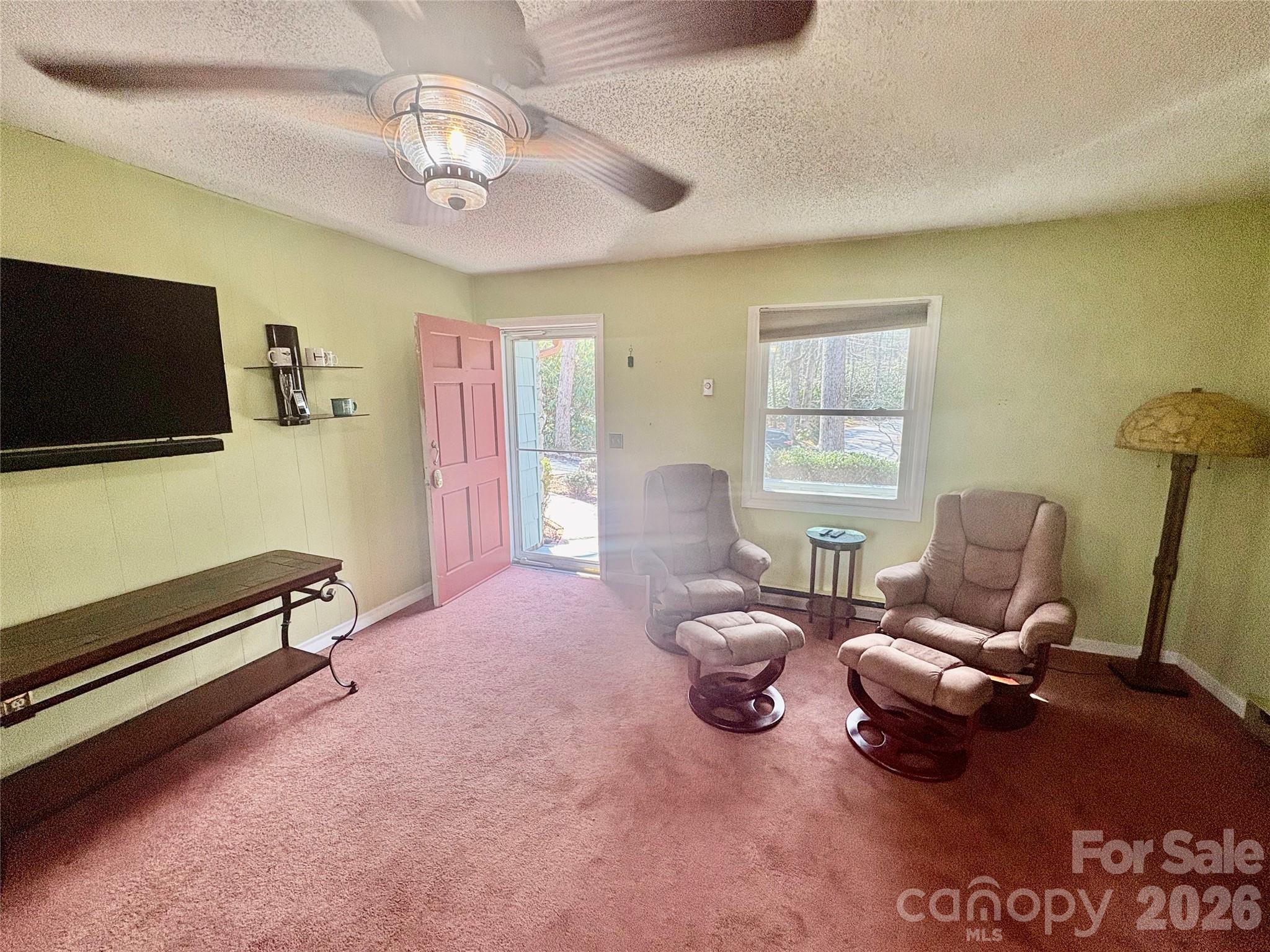 126 Ridgeview Road Spruce Pine, NC 28777 - Photo 16 of 39 a living room with furniture and a flat screen tv