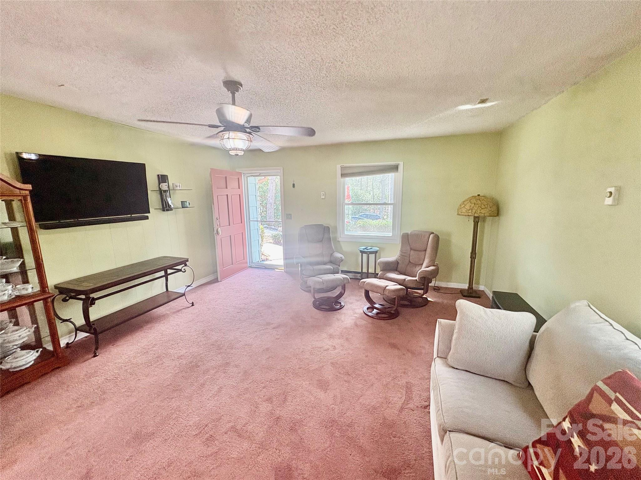 126 Ridgeview Road Spruce Pine, NC 28777 - Photo 17 of 39 a living room with furniture and a flat screen tv