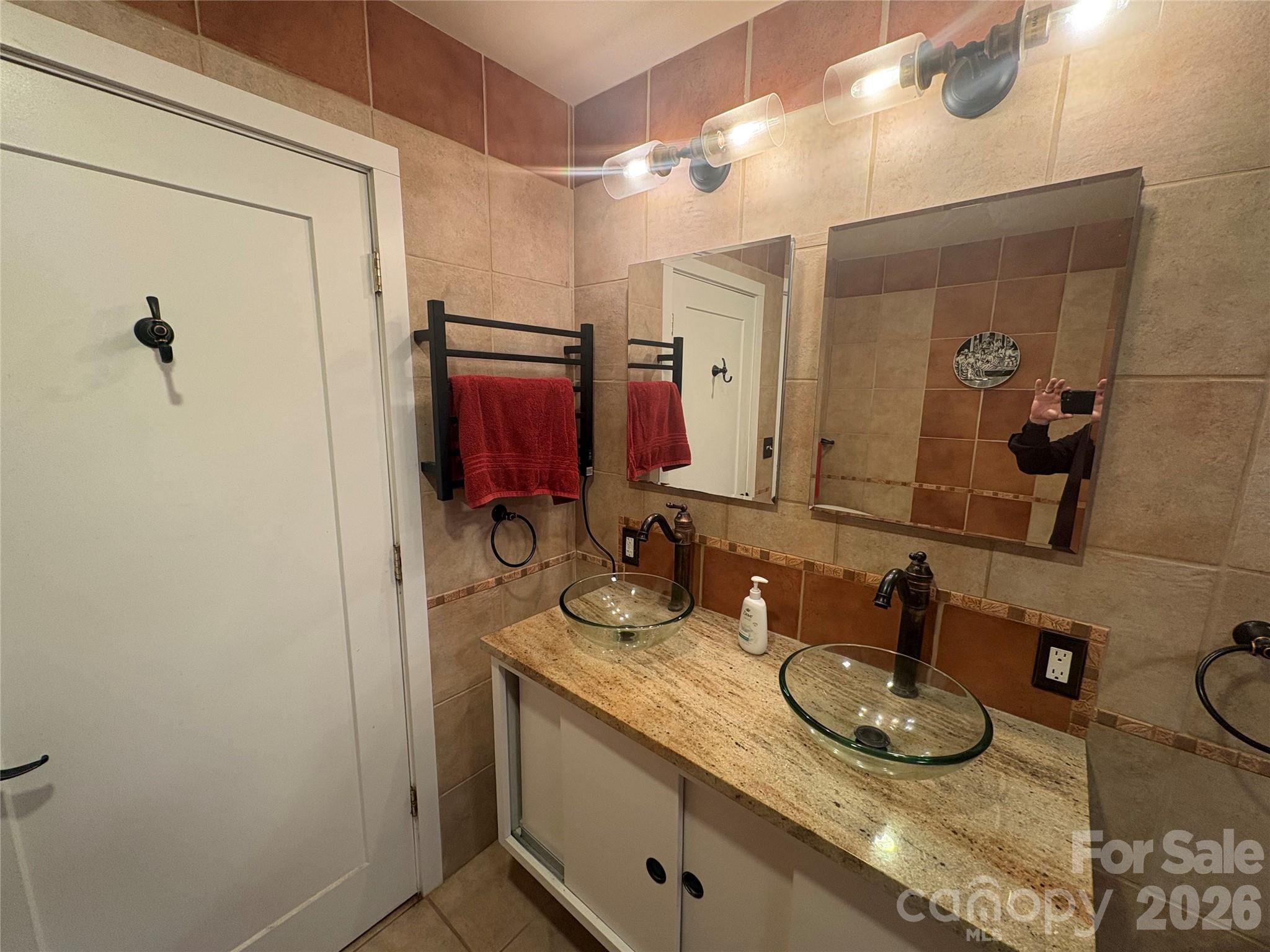 126 Ridgeview Road Spruce Pine, NC 28777 - Photo 19 of 39 a bathroom with a granite countertop sink and a mirror