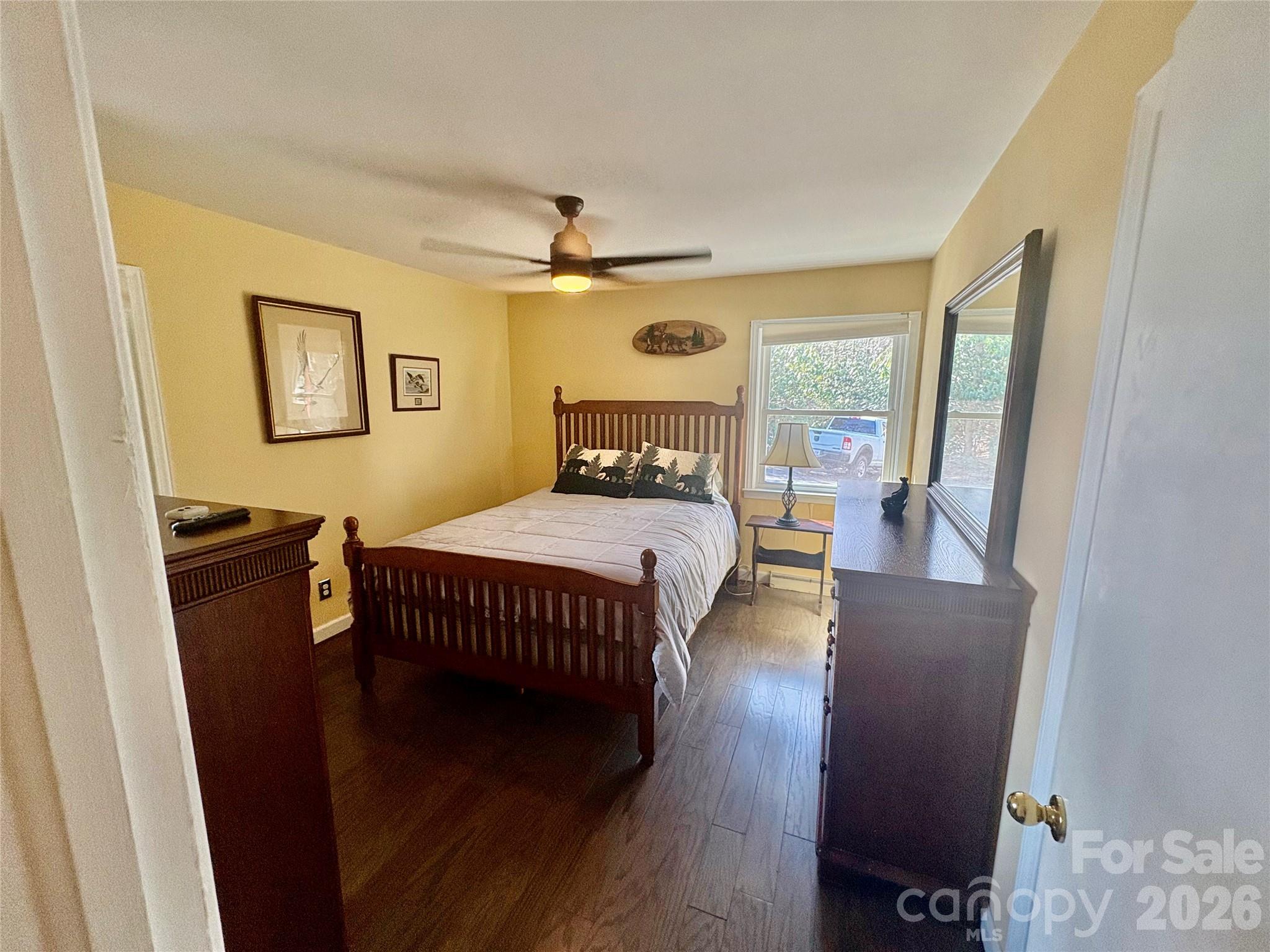 126 Ridgeview Road Spruce Pine, NC 28777 - Photo 25 of 39 a bedroom with a bed and wooden floor