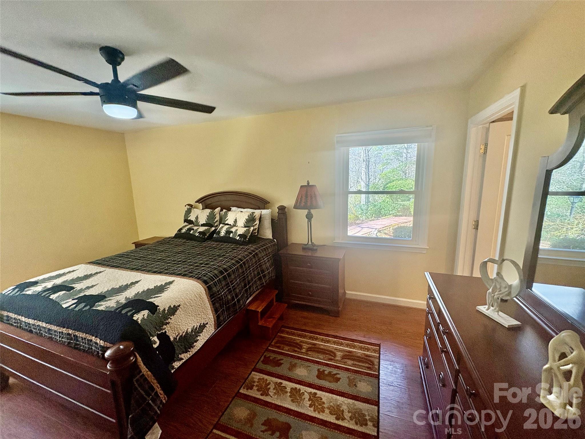 126 Ridgeview Road Spruce Pine, NC 28777 - Photo 26 of 39 a bedroom with a bed and wooden floor