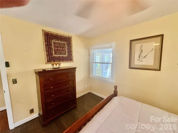 a room with a bed and a window