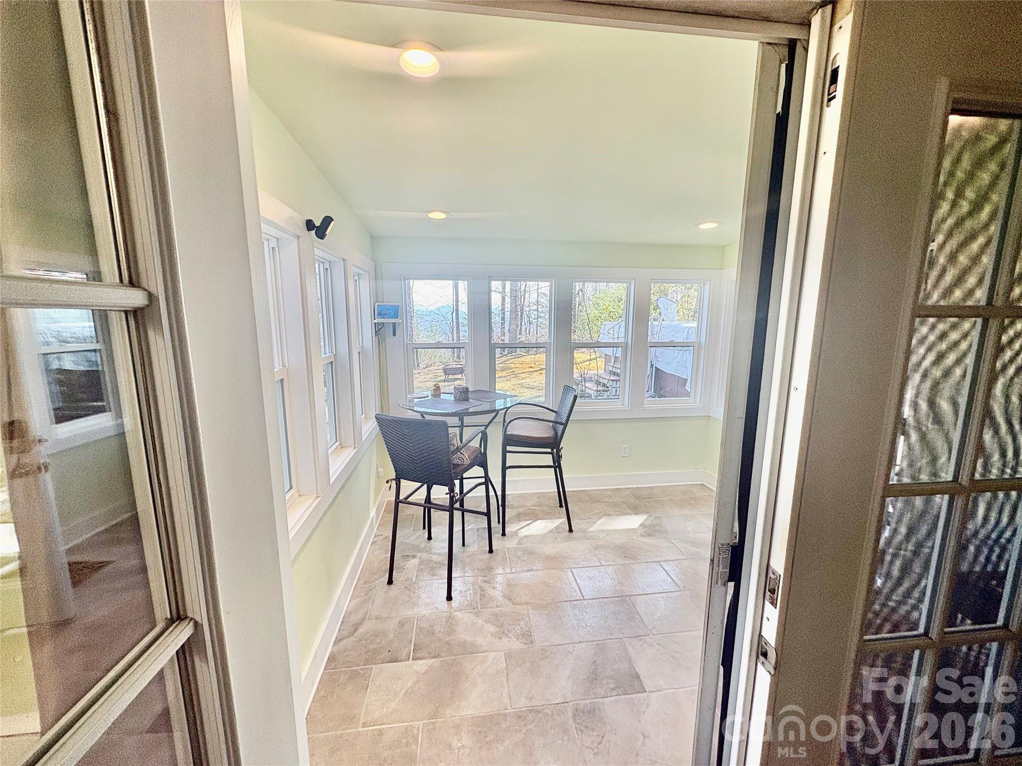 126 Ridgeview Road Spruce Pine, NC 28777 - Photo 29 of 39 a view of a dining room with furniture a livingroom and front door