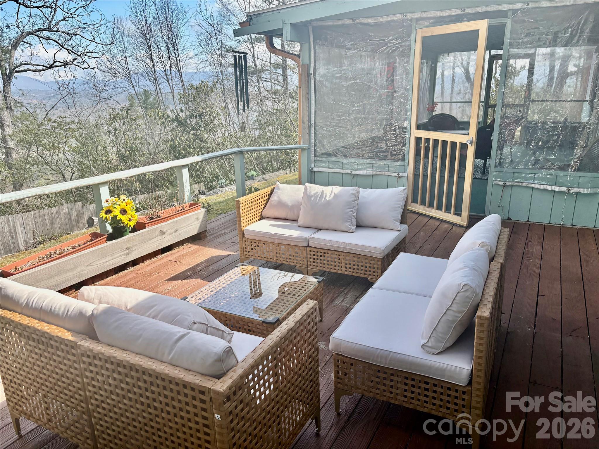 126 Ridgeview Road Spruce Pine, NC 28777 - Photo 33 of 39 a balcony with furniture and wooden floor