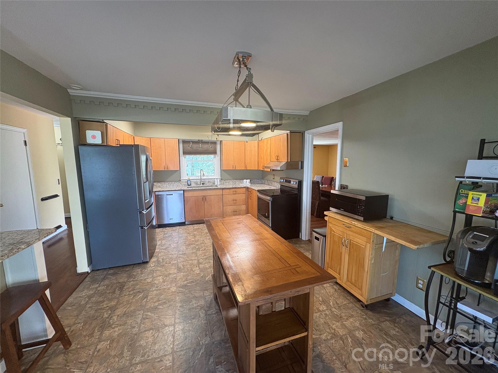 126 Ridgeview Road Spruce Pine, NC 28777 - Photo 8 of 39 a kitchen with stainless steel appliances granite countertop a refrigerator and a stove top oven