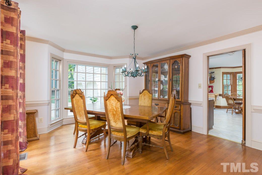 117 Trotters Ridge Drive Raleigh, NC 27614 - Photo 14 of 22 a view of a dining room with furniture window and wooden floor