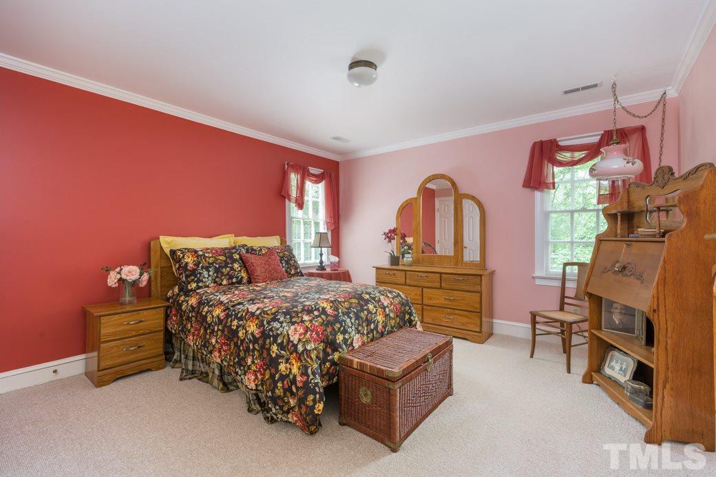 117 Trotters Ridge Drive Raleigh, NC 27614 - Photo 22 of 22 a bedroom with bed and a dresser