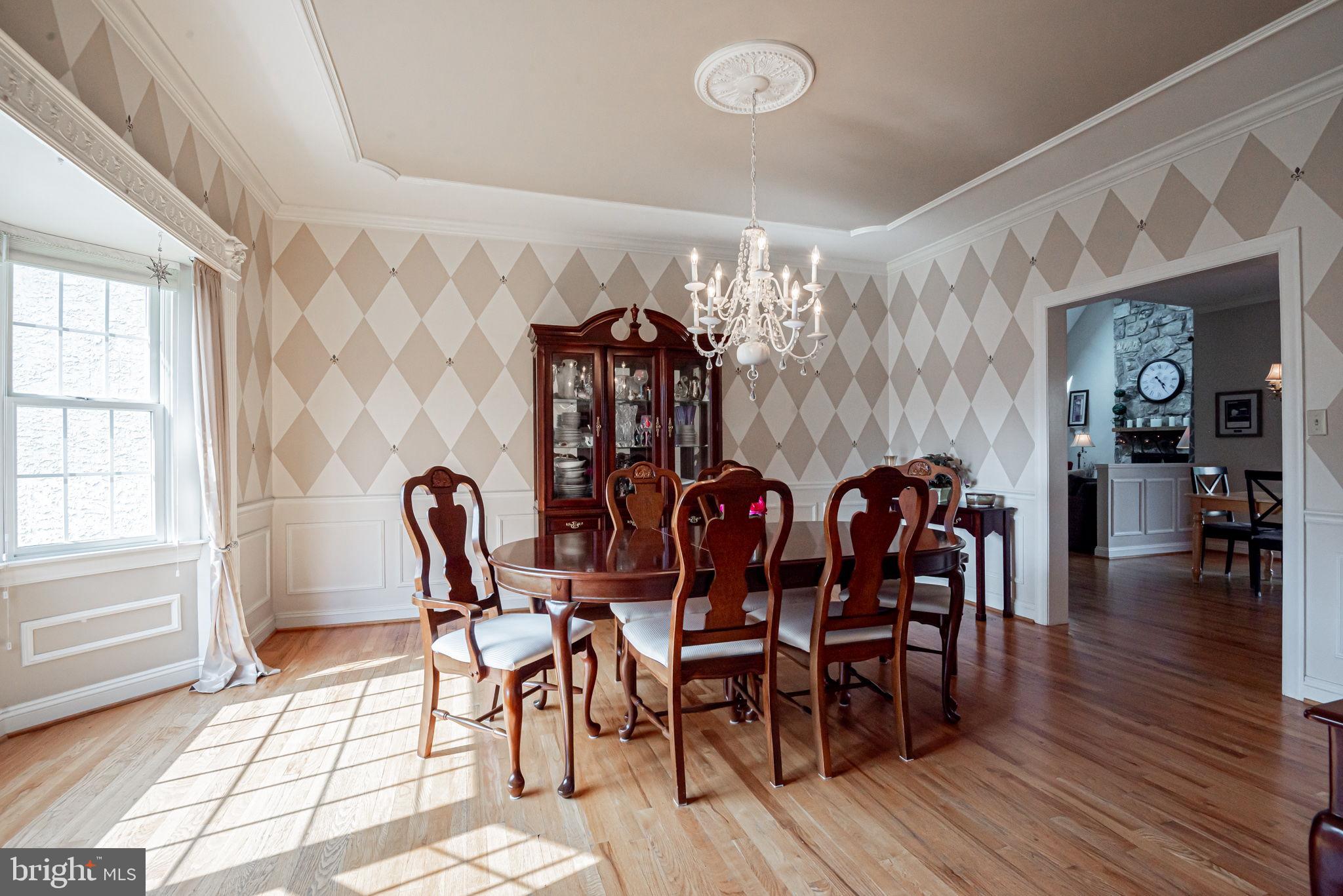 706 Regency Hill Road Hockessin, DE 19707 - Photo 11 of 54 a view of a dining room with furniture and wooden floor