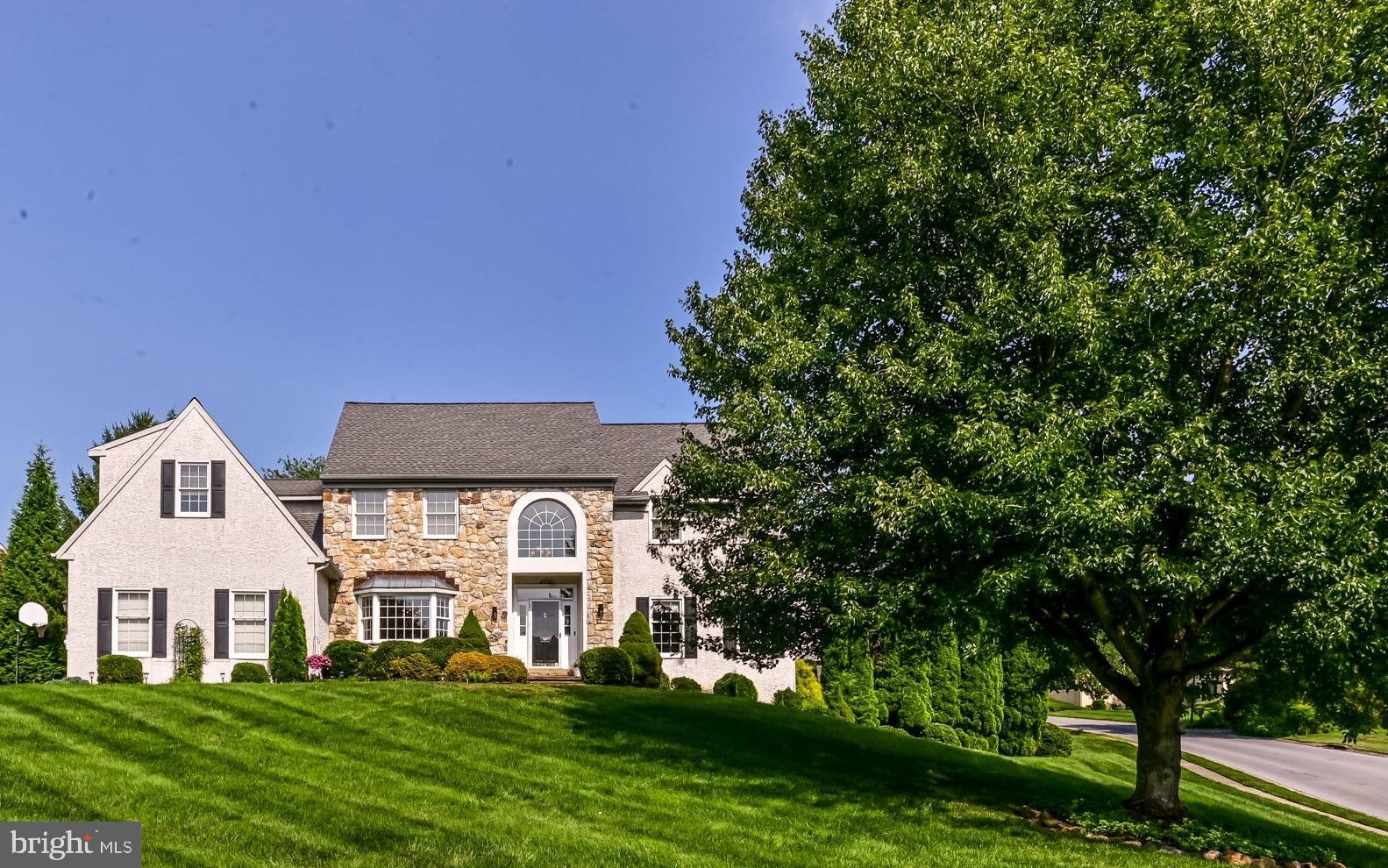 706 Regency Hill Road Hockessin, DE 19707 - Photo 2 of 54 a front view of a house with a yard