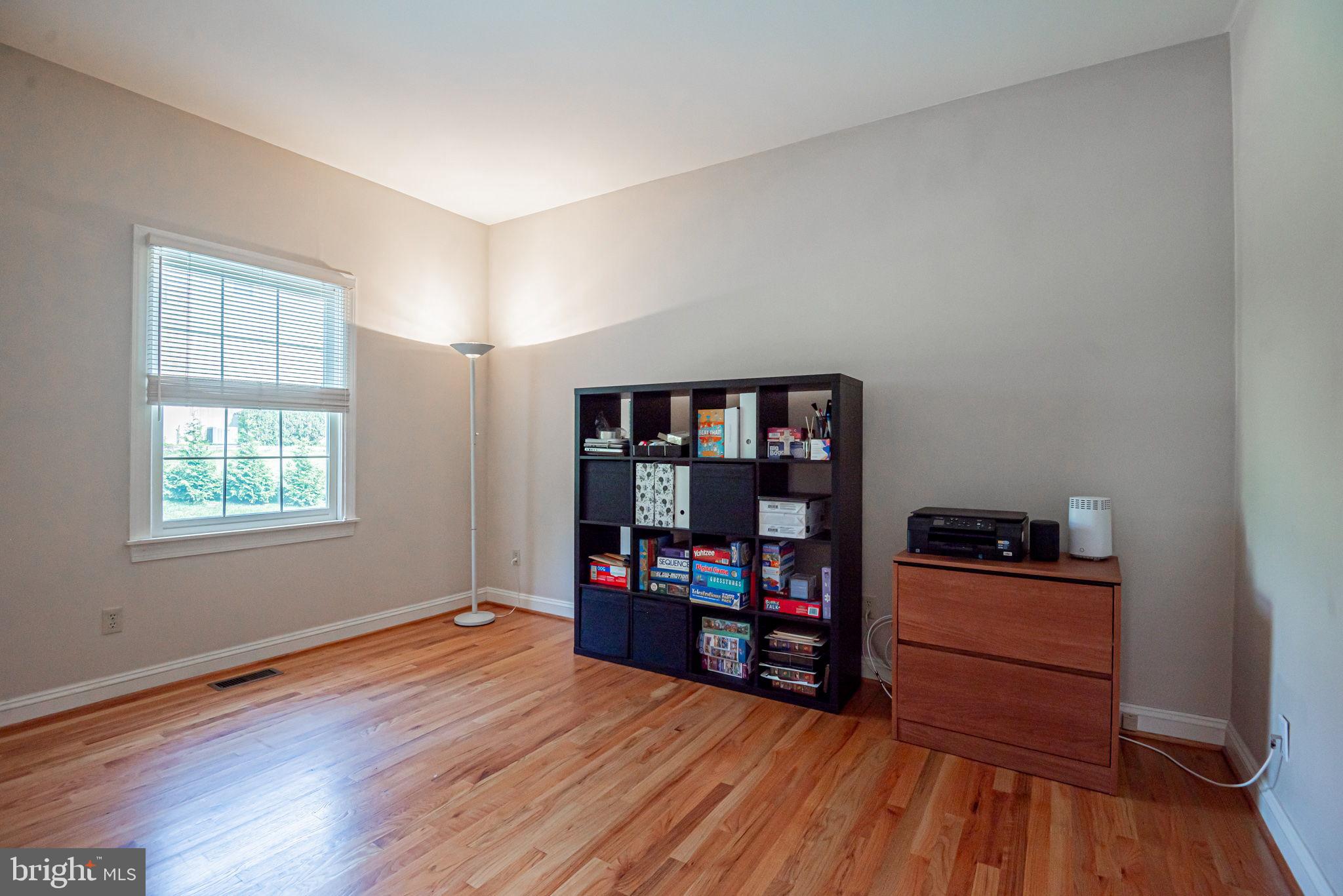 706 Regency Hill Road Hockessin, DE 19707 - Photo 24 of 54 a room with furniture and wooden floor