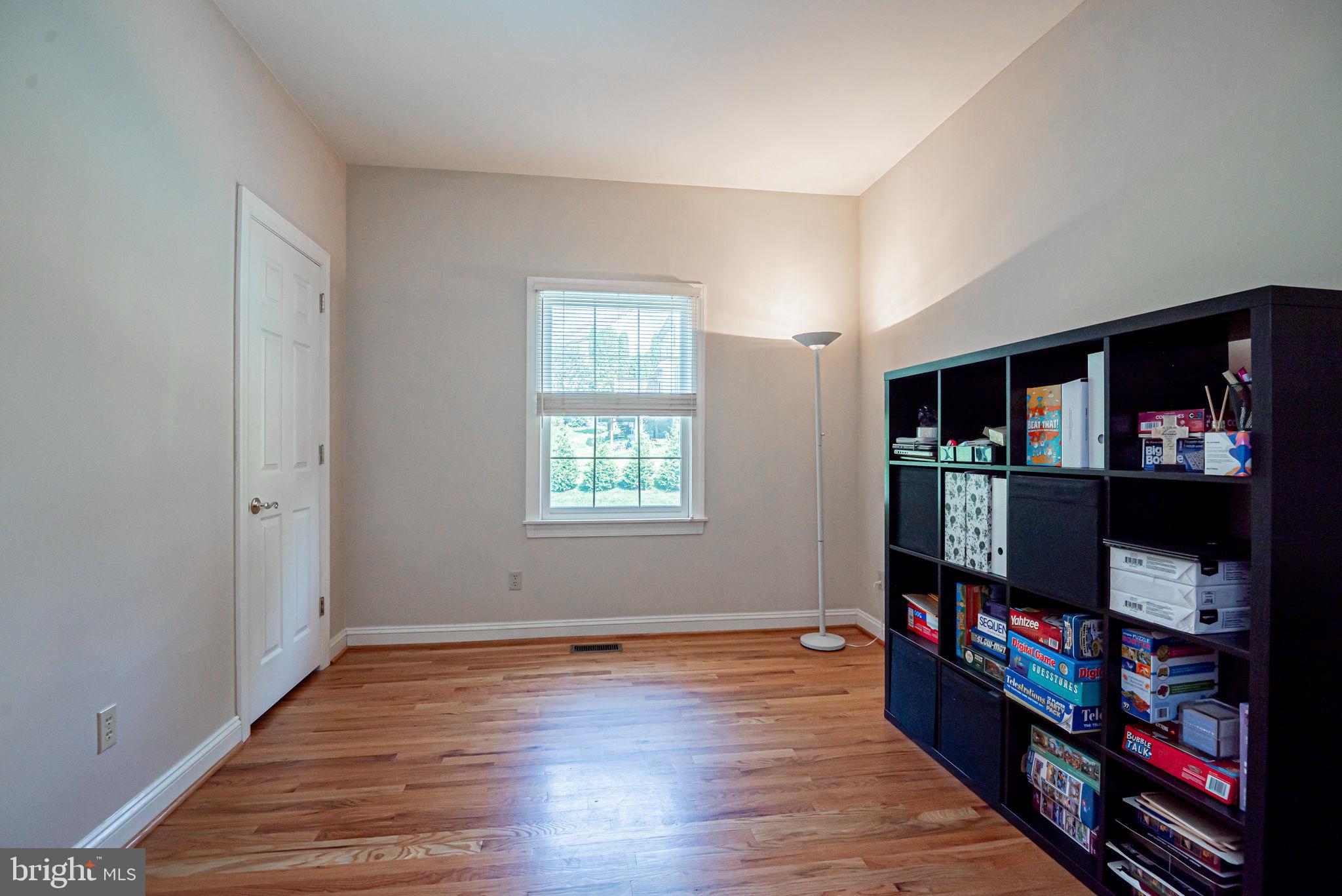 706 Regency Hill Road Hockessin, DE 19707 - Photo 25 of 54 a room with furniture and a book shelf