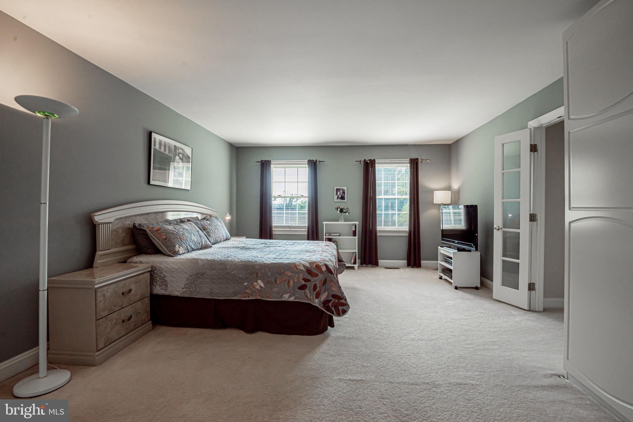 706 Regency Hill Road Hockessin, DE 19707 - Photo 28 of 54 a spacious bedroom with a bed and a view of bedroom