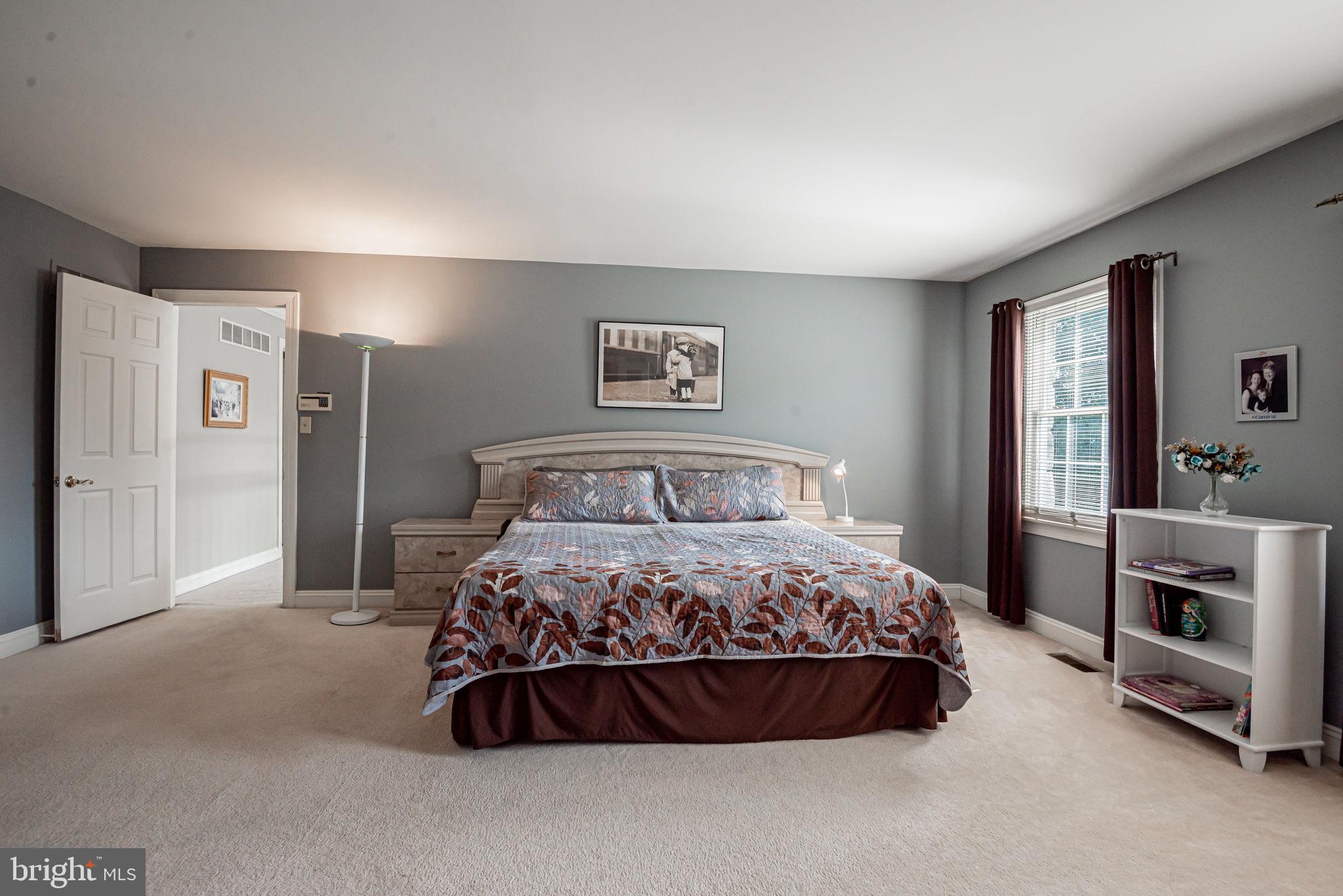 706 Regency Hill Road Hockessin, DE 19707 - Photo 29 of 54 a bedroom with a bed and a television