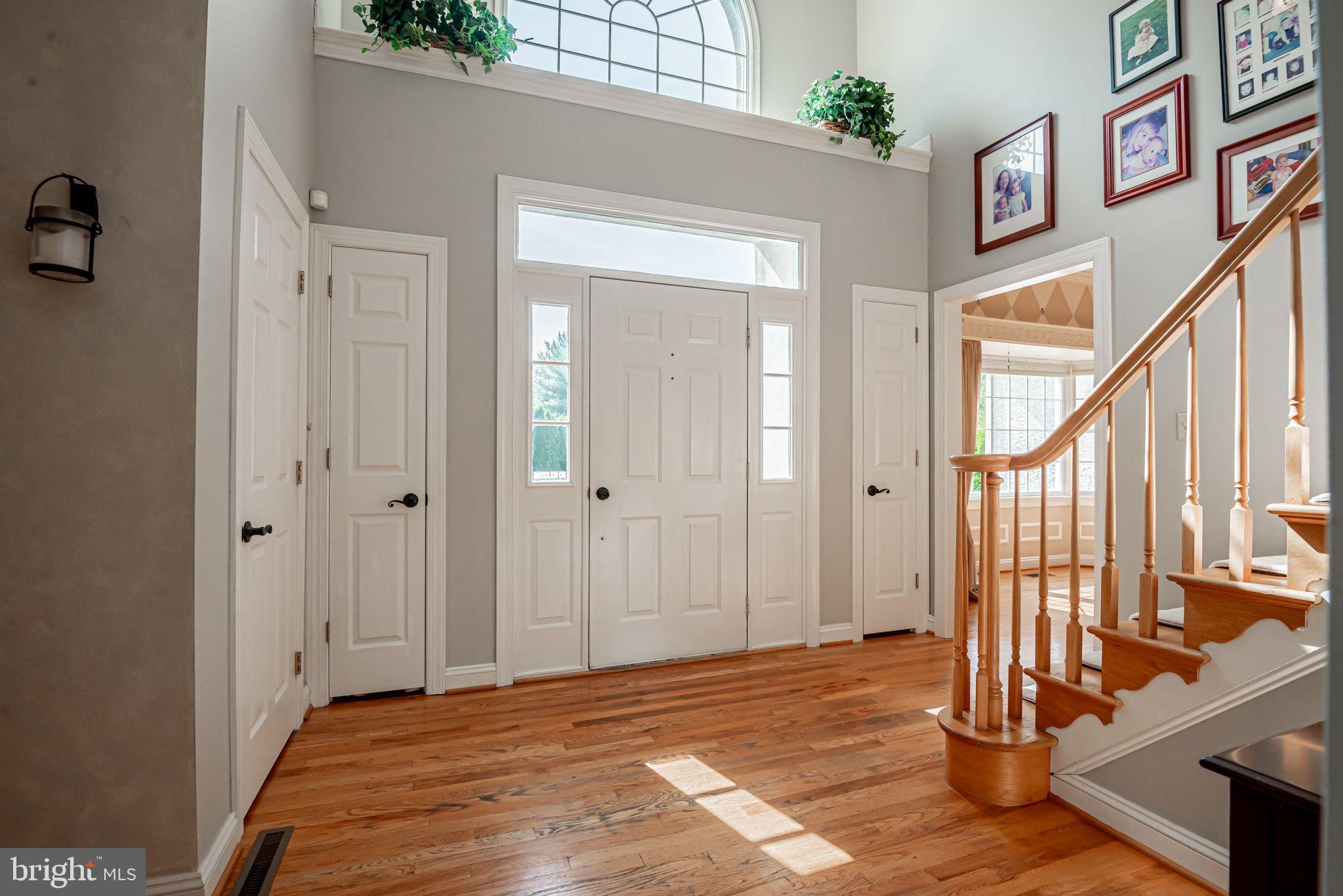 706 Regency Hill Road Hockessin, DE 19707 - Photo 3 of 54 a view of an entryway with wooden floor and door