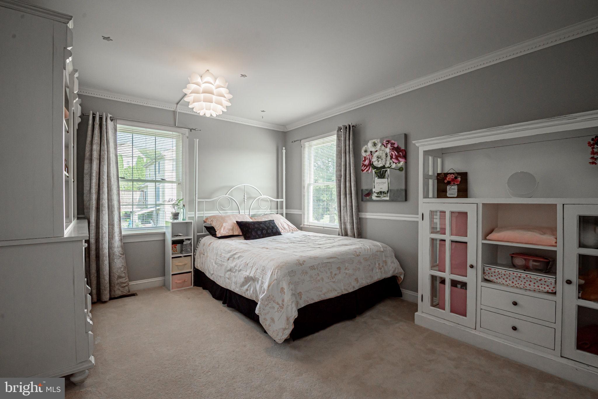 706 Regency Hill Road Hockessin, DE 19707 - Photo 37 of 54 a bedroom with a bed closet and a window