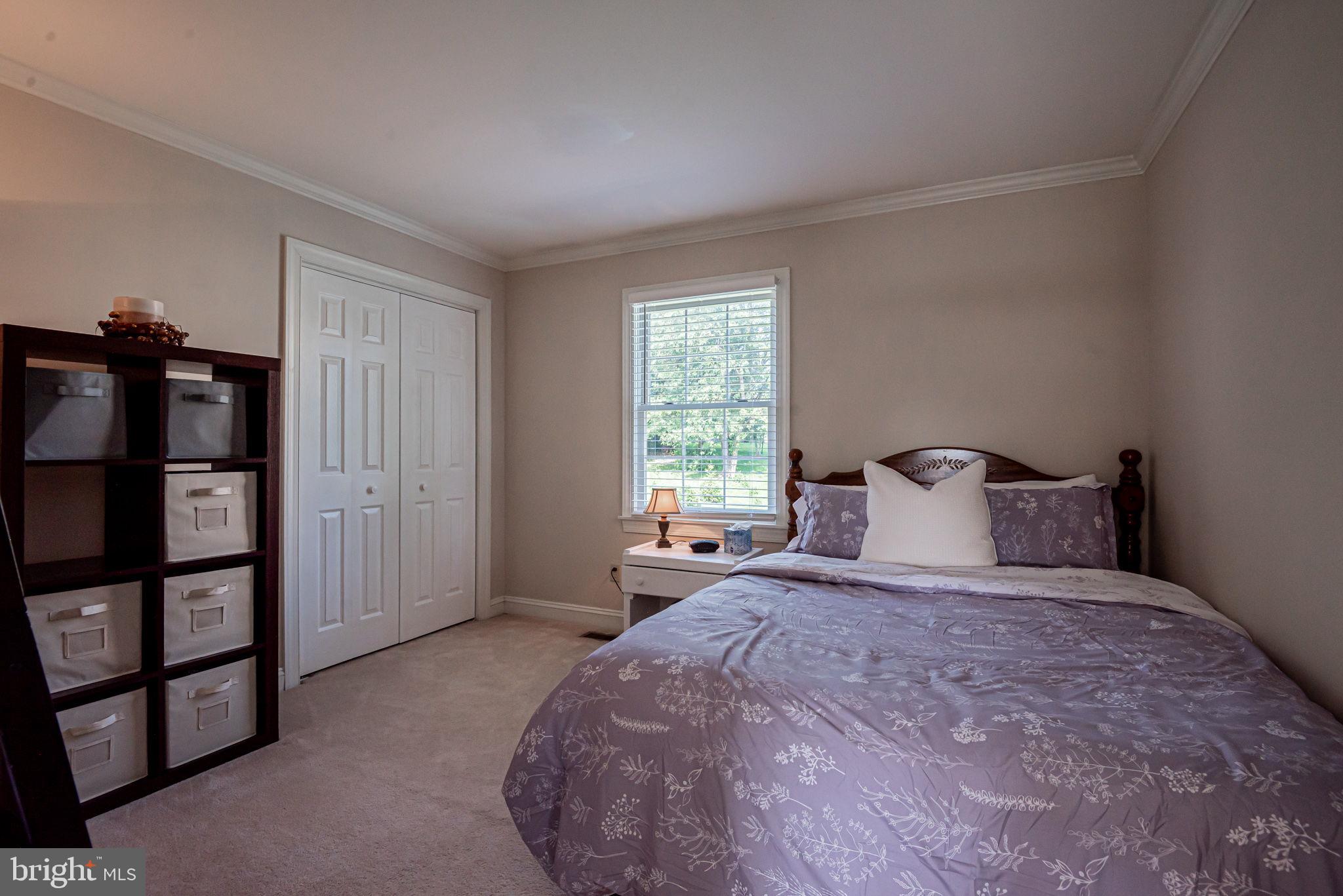 706 Regency Hill Road Hockessin, DE 19707 - Photo 38 of 54 a large bed sitting in a bedroom next to a window